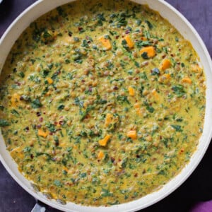 panful of lentil coconut curry on a slate table