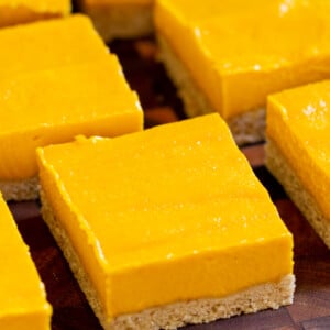 close-up of sliced mango bars on a cutting board