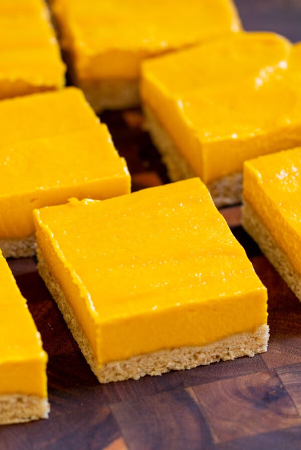 close-up of sliced mango bars on a cutting board