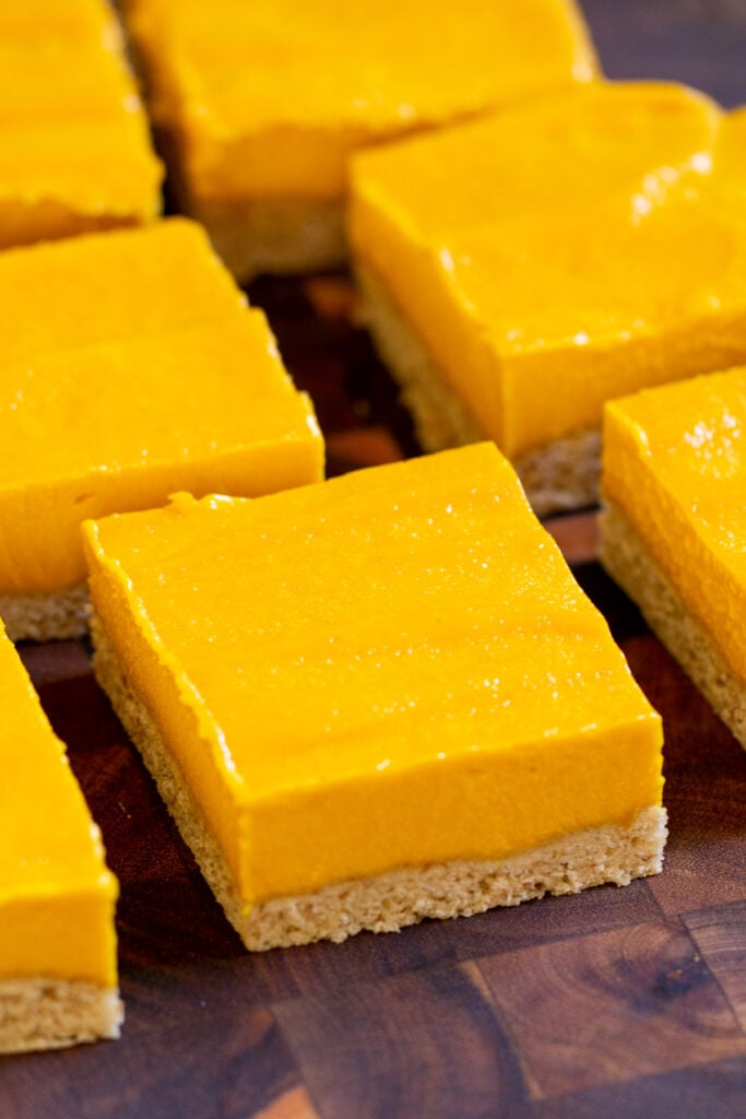 close-up of sliced mango bars on a cutting board