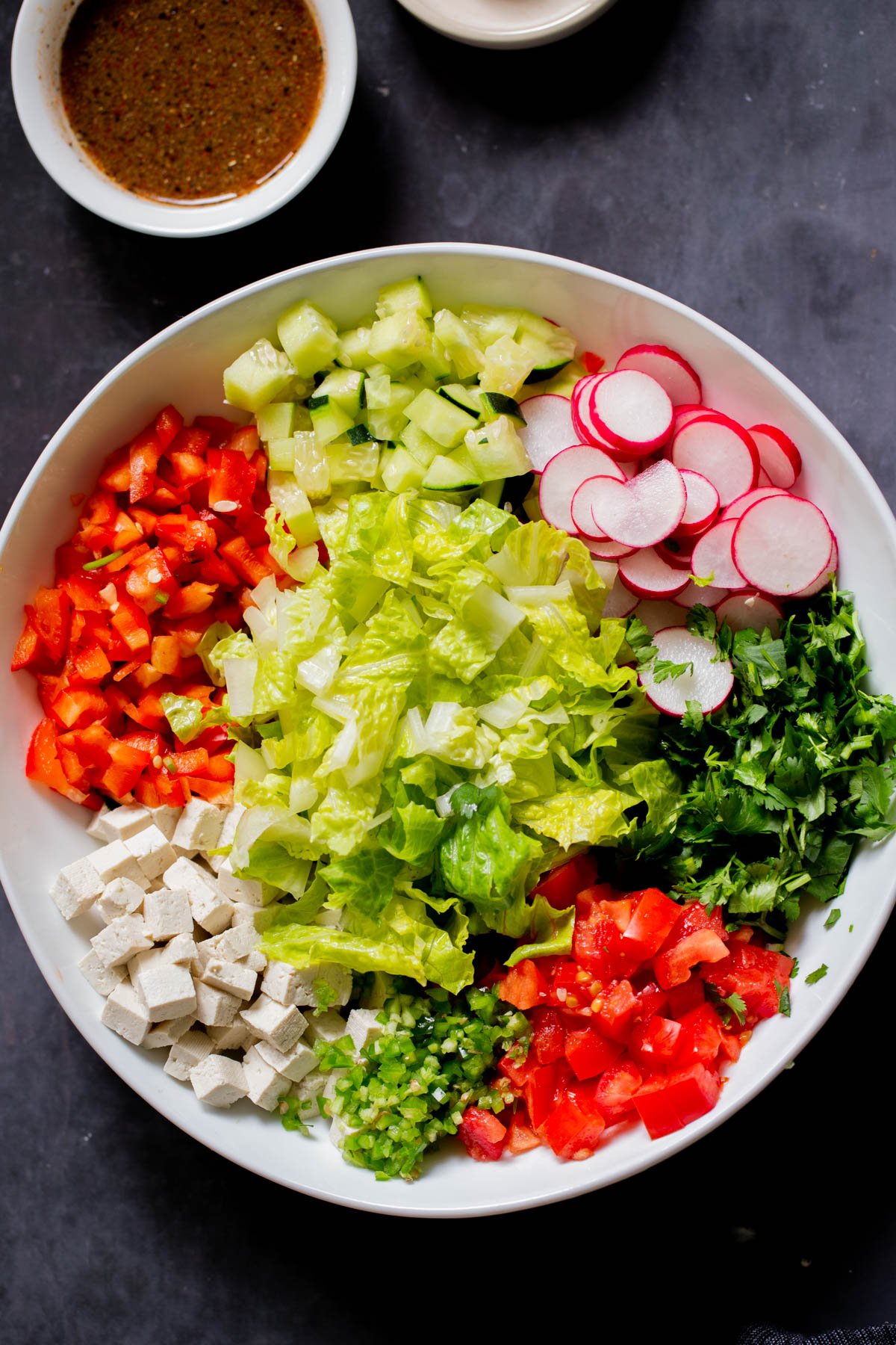 tofu, cilantro, and veggies in the mixing bowl before mixing