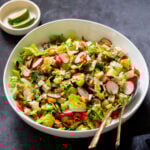 chaat masala salad in the mixing bowl with serving spoons