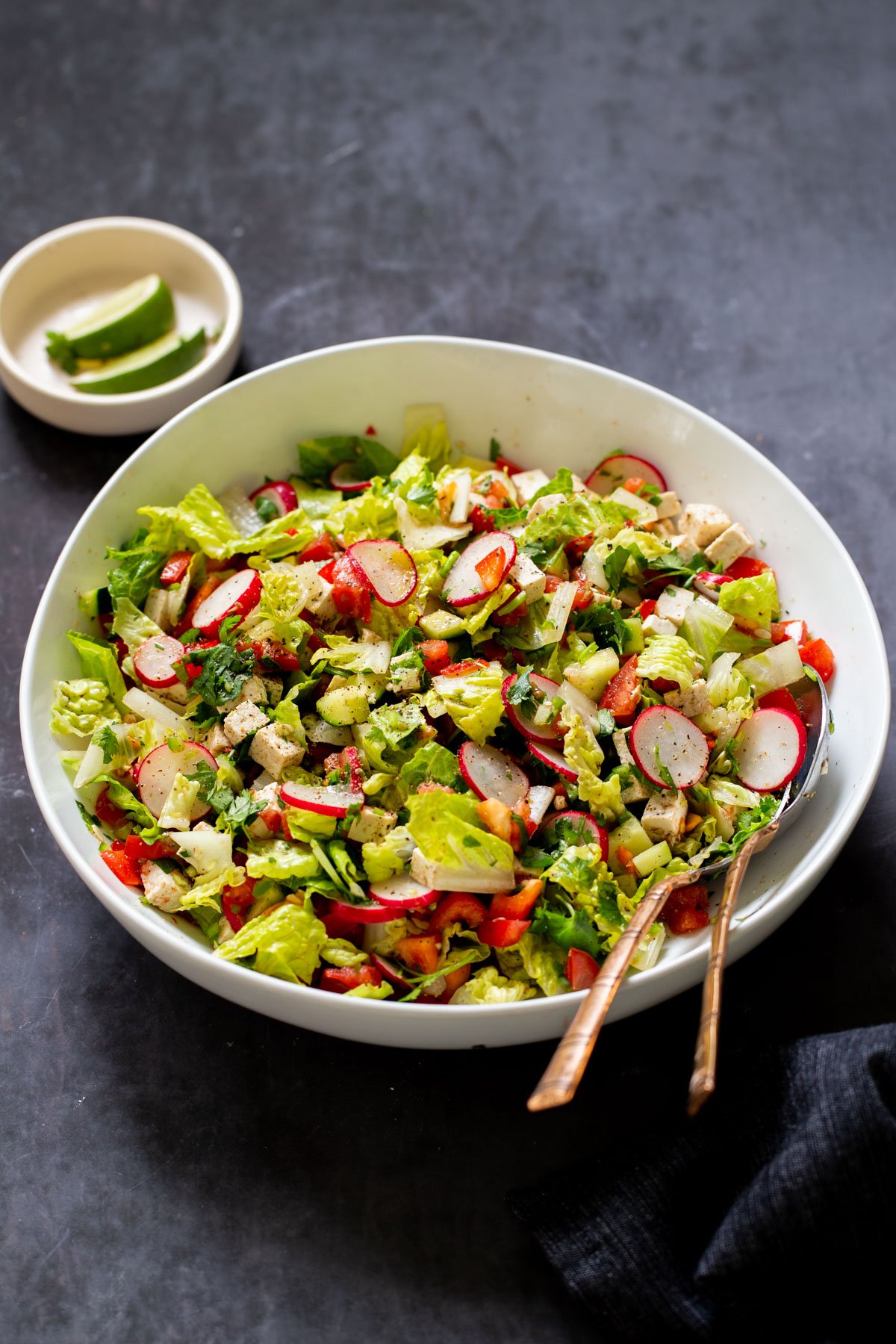chaat masala salad in the mixing bowl with serving spoons