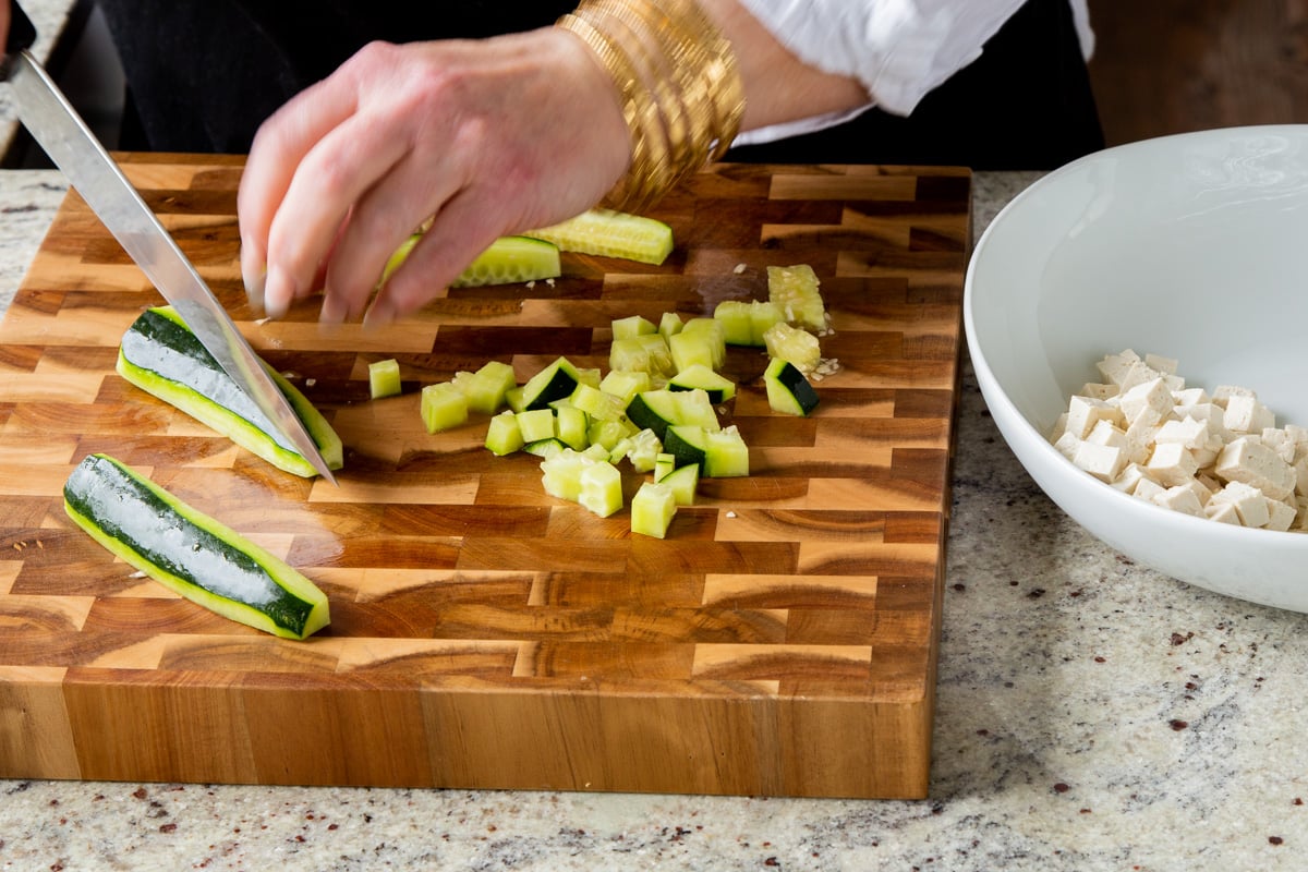 chopping the cucumber