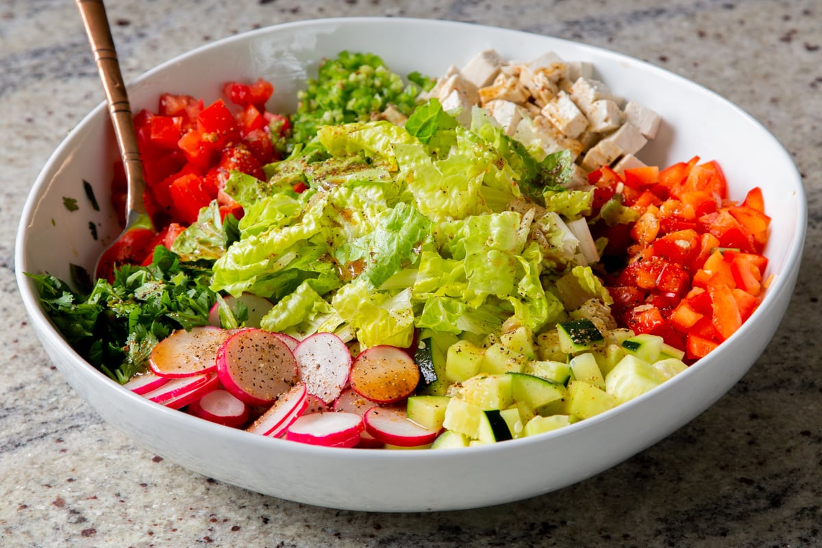 tofu, cilantro, and veggies in the mixing bowl before mixing