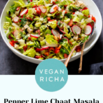 chaat masala salad in the mixing bowl with serving spoons, text overlay
