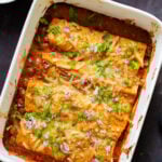 butter chicken enchiladas in the baking pan