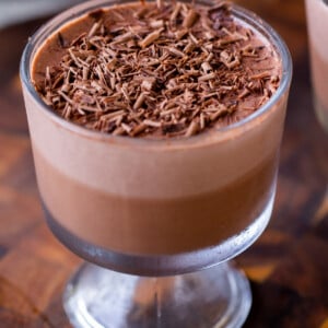 cup of two-layer vegan chocolate pudding with chocolate shavings on top