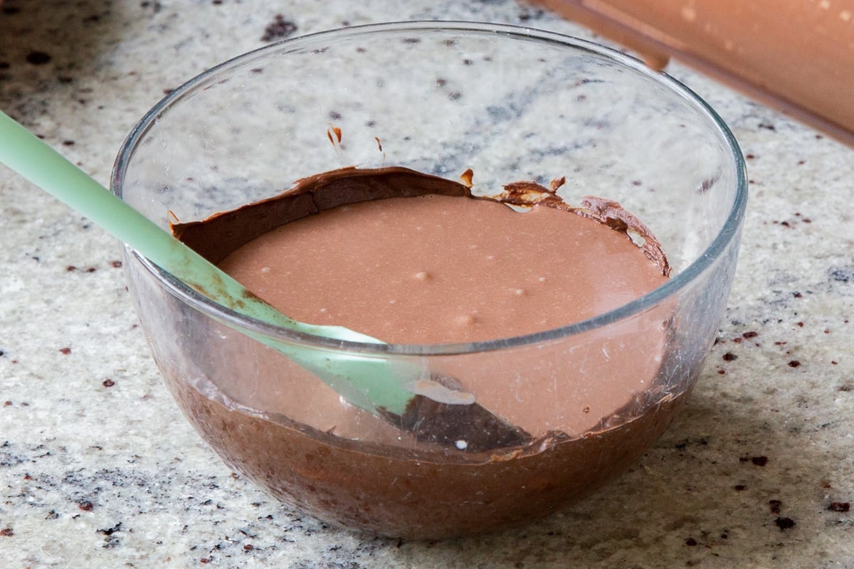 adding mousse to the melted chocolate chips