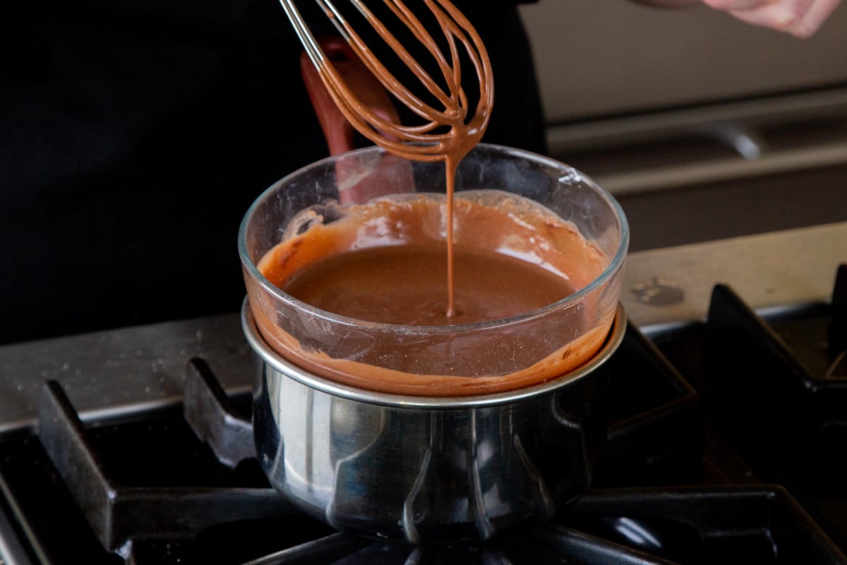 warming the mousse-chocolate mixture in a double boiler