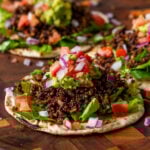 3 crispy quinoa tacos on a serving tray