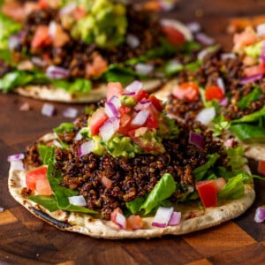 3 crispy quinoa tacos on a serving tray