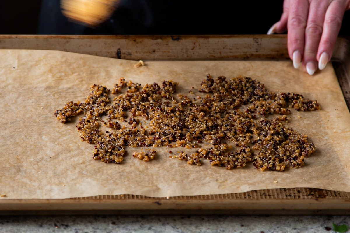 spreading the quinoa taco meat onto a baking sheet