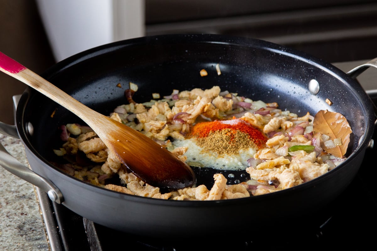 adding dried spices to the soy curls