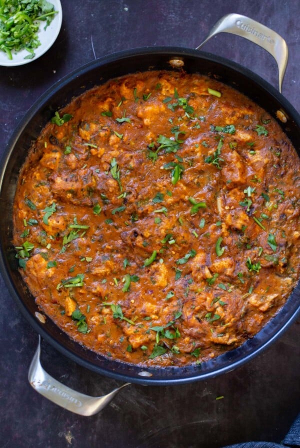Hyderabadi chicken curry in the pan with cilantro on top