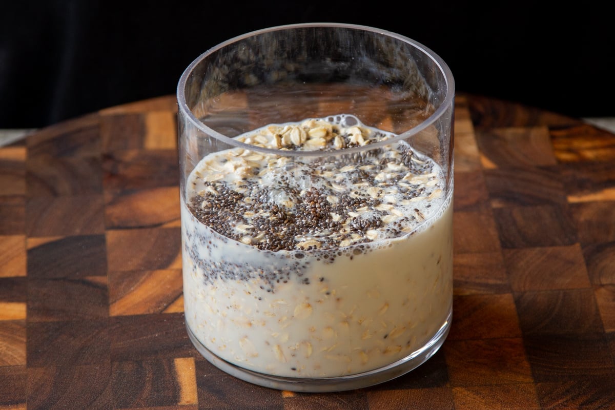 adding milk to the oats and chia seeds