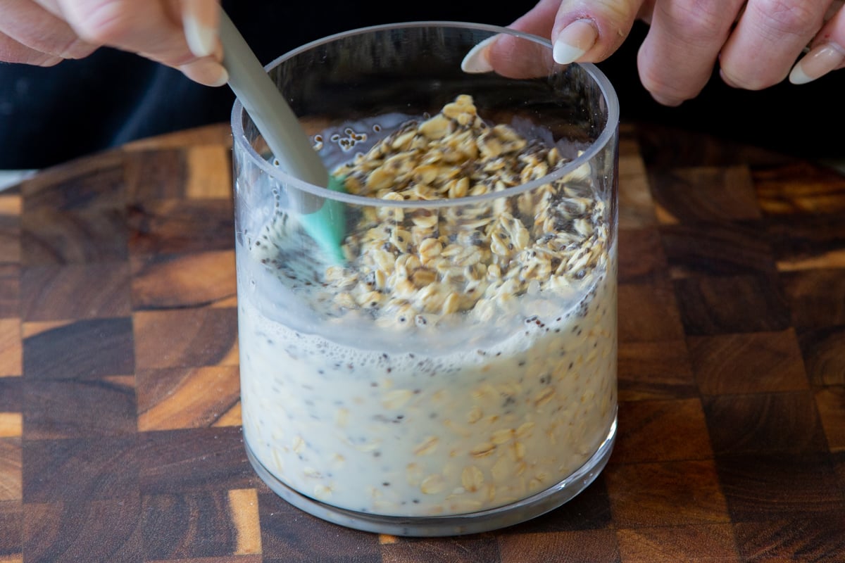 mixing the chia seeds with the oats and milk