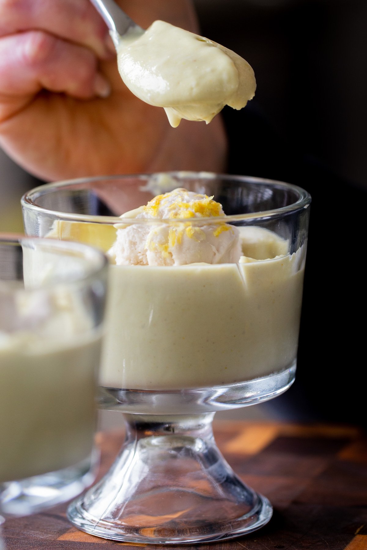 spoon taking a bite of lemon pudding