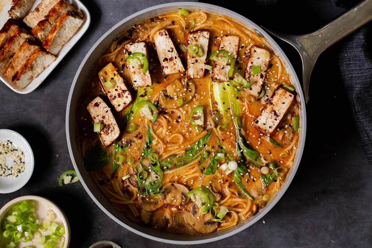vegan tonkotsu in the pan after adding tofu and toppings