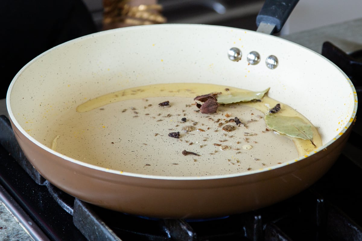 toasting the whole spices in the pan