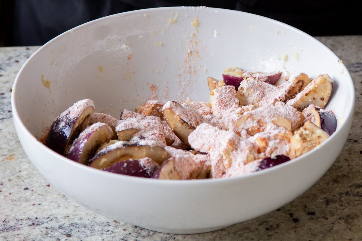 sprinkling cornstarch and spices over the eggplant and tofu