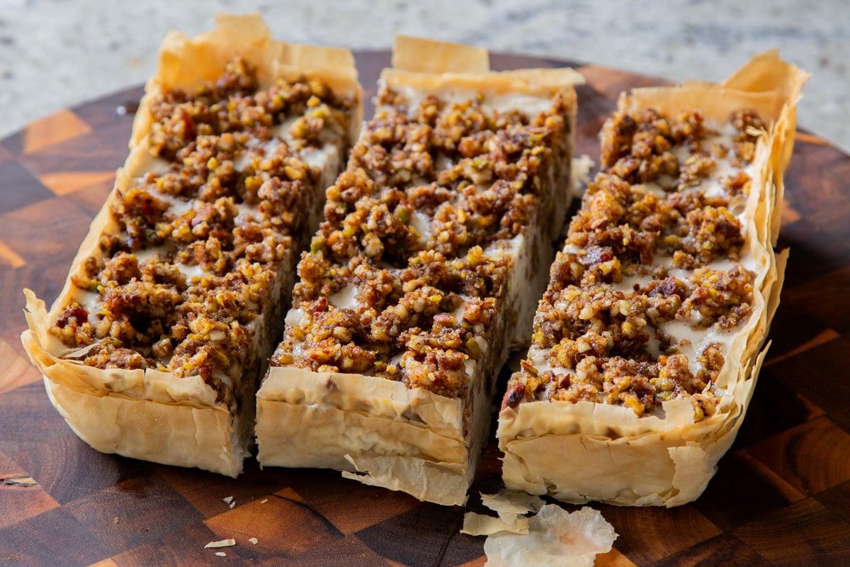 partially sliced baklava cheesecake