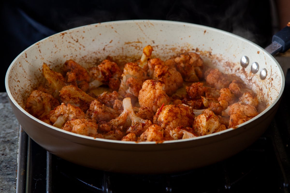 harissa paste and spices toss with the cauliflower, before cooking