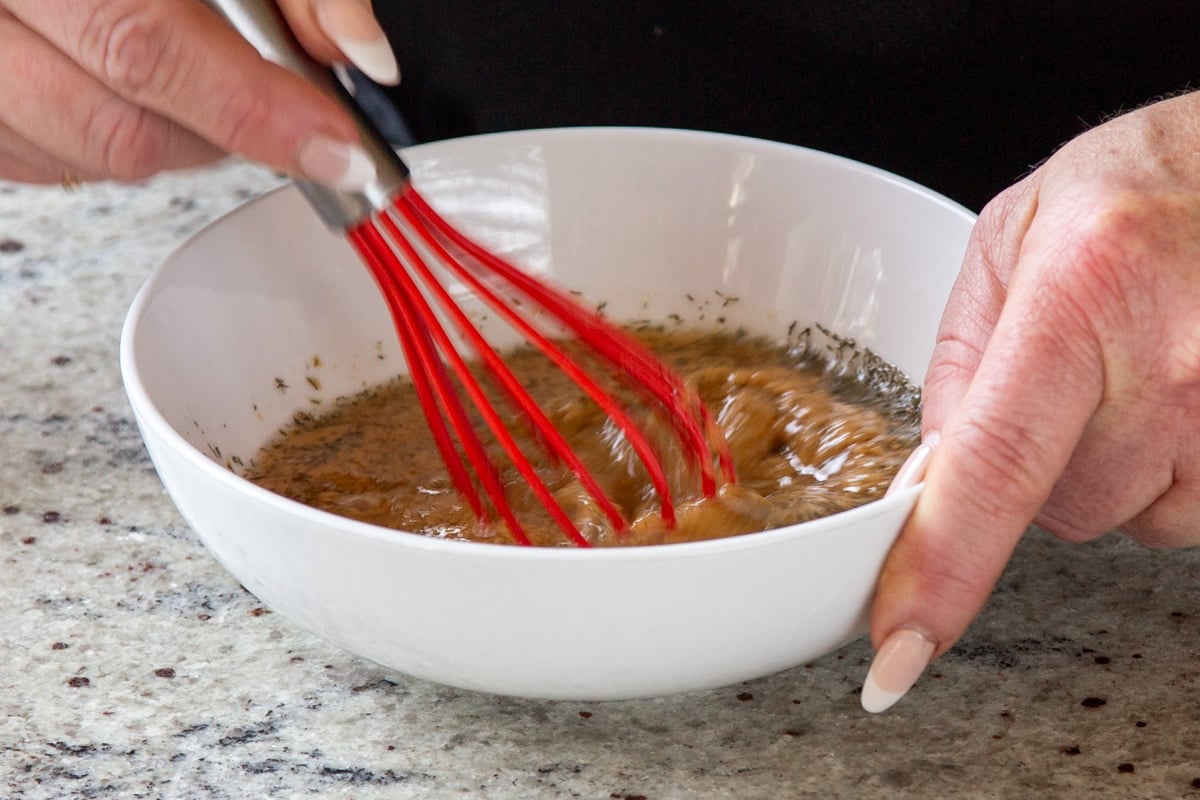 whisking the tahini sauce together