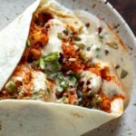 harissa cauliflower wrap with tahini sauce and vegetables