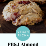 gf peanut butter and jelly cookies on a wooden cutting board, text overlay