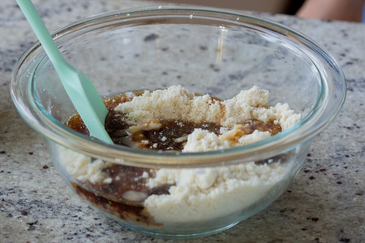 adding wet ingredients to the dry