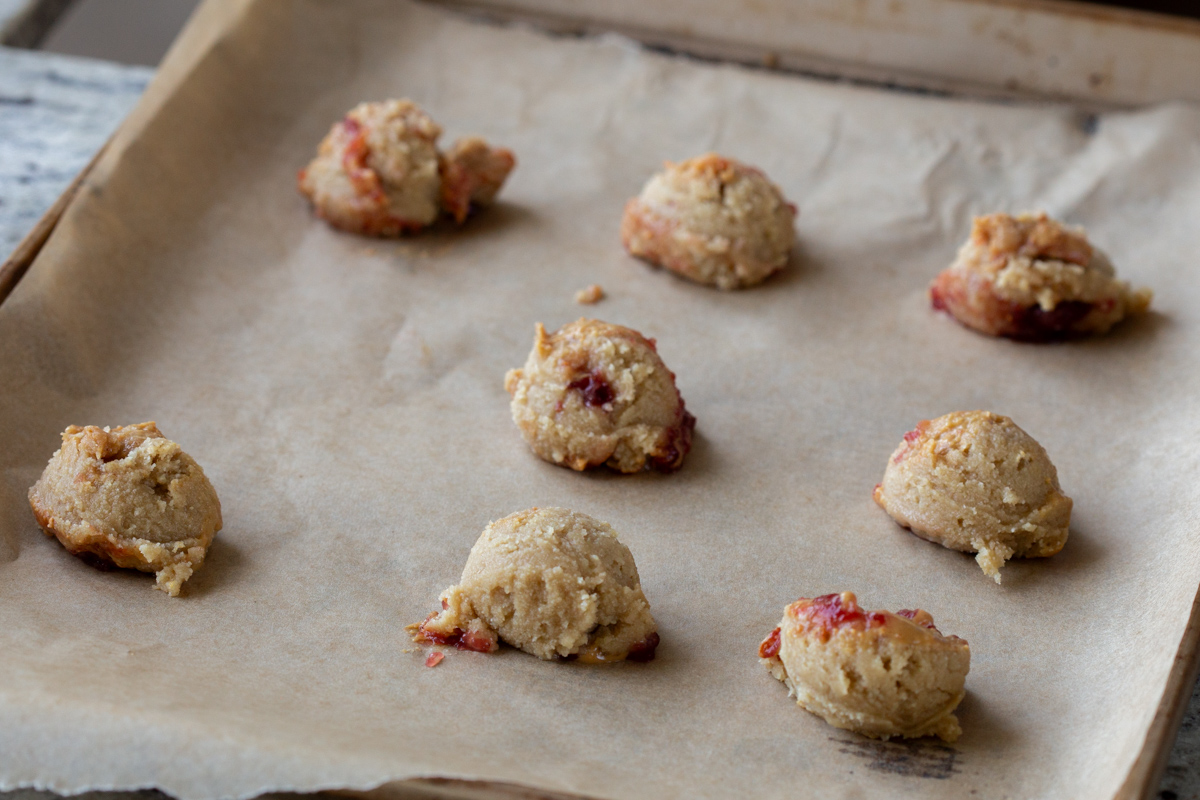 unbaked cookies, scooped onto the baking sheet
