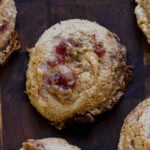close-up of gluten-free peanut butter and jelly cookies on a wooden cutting board