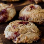 gf peanut butter and jelly cookies on a wooden cutting board