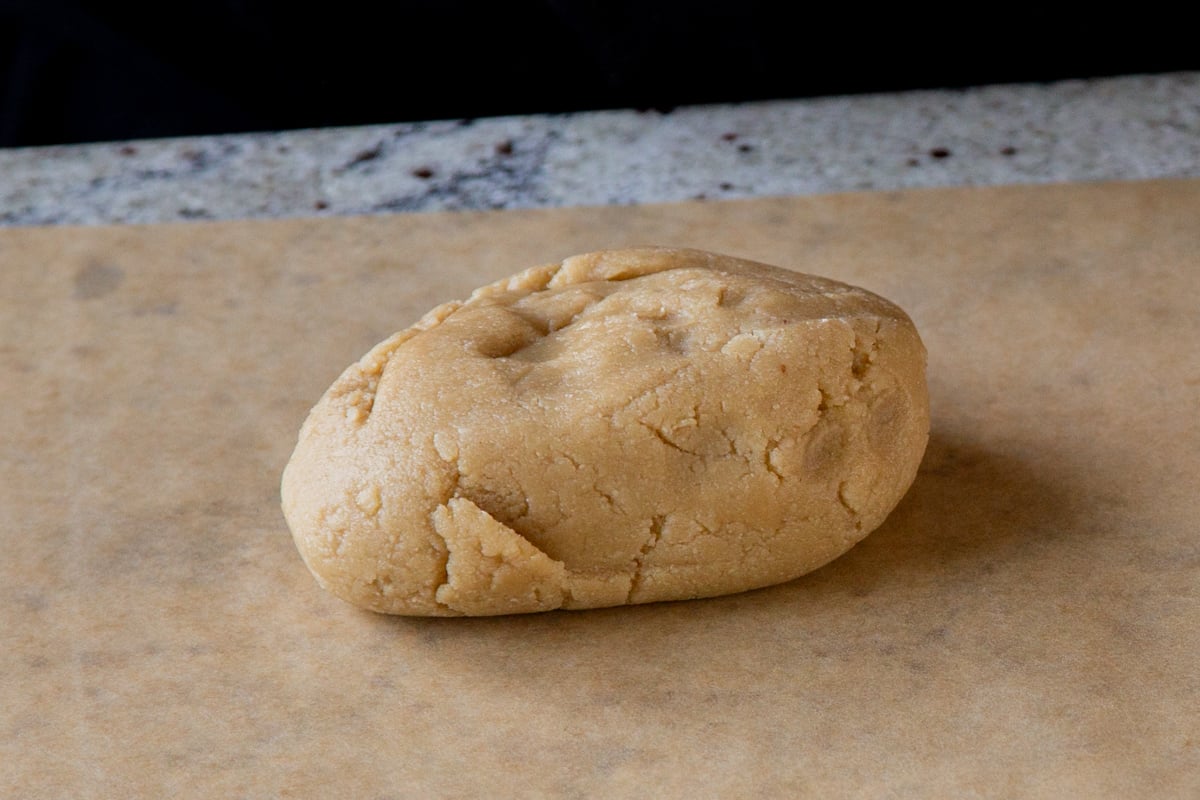 almond flour cookie dough on a parchment sheet
