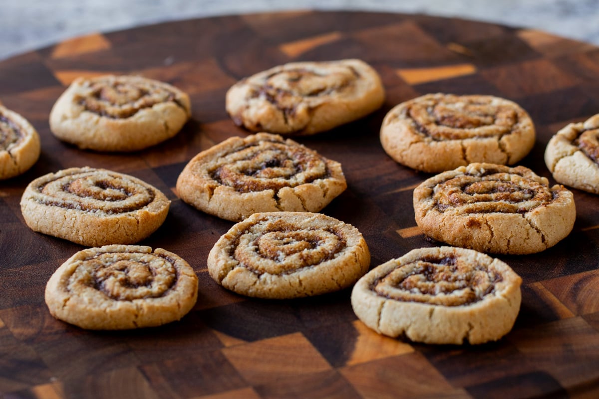 pumpkin spice roll cookies on a wooden tray