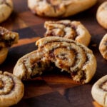 close-up of a pumpkin spice roll cookie broken in half, so you can see the texture