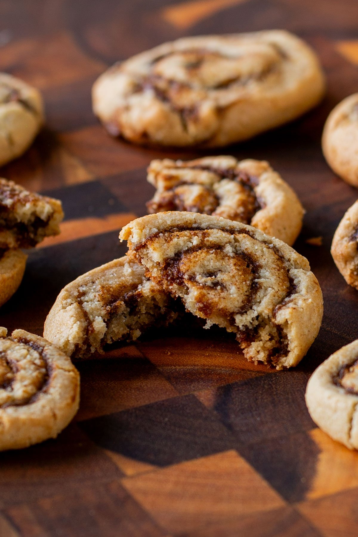 close-up of a pumpkin spice roll cookie broken in half, so you can see the texture