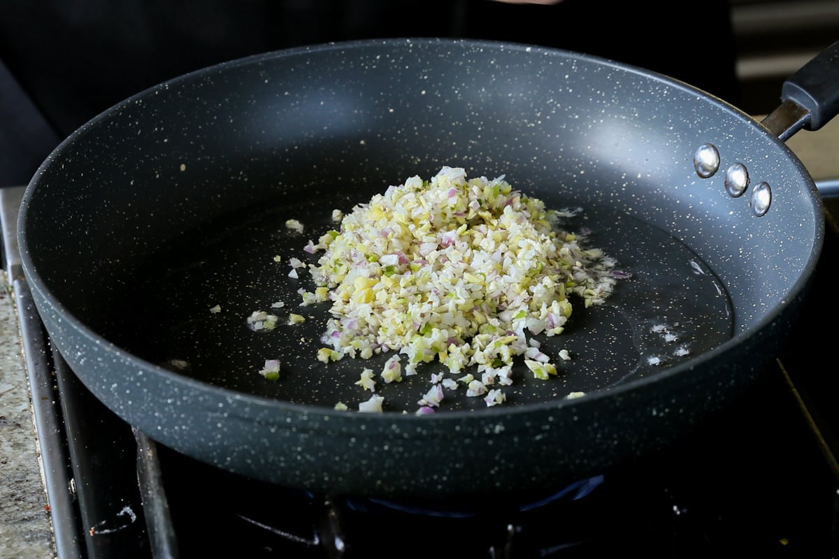 adding the aromatics to the hot pan