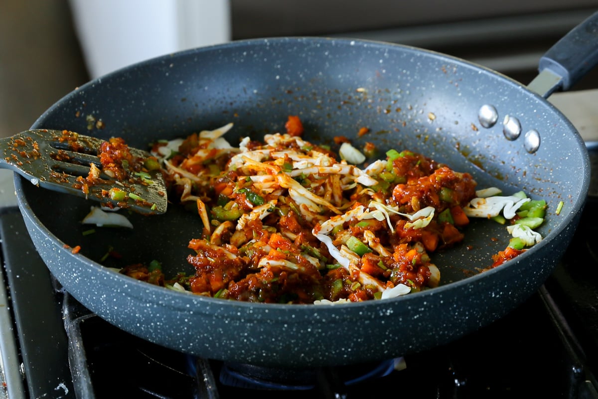 cabbage after mixing with the other veggies in the Schezwan sauce