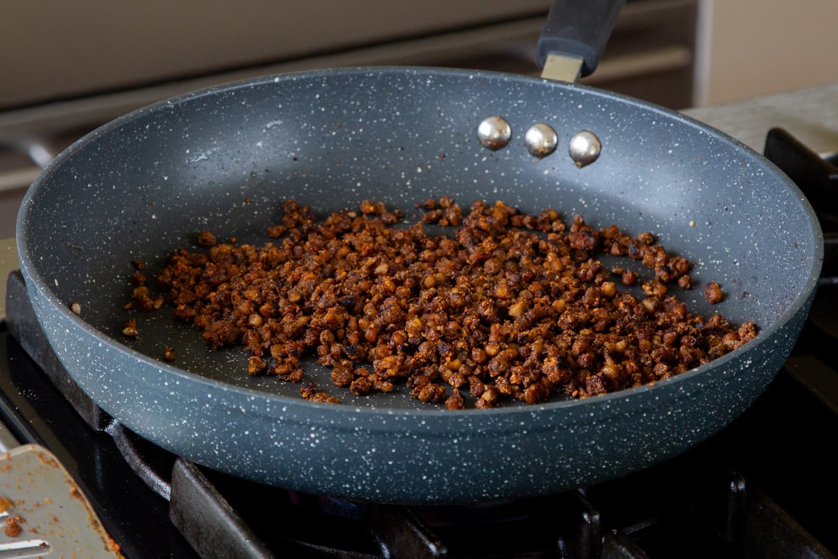 smoky, crispy lentils in the pan after cooking