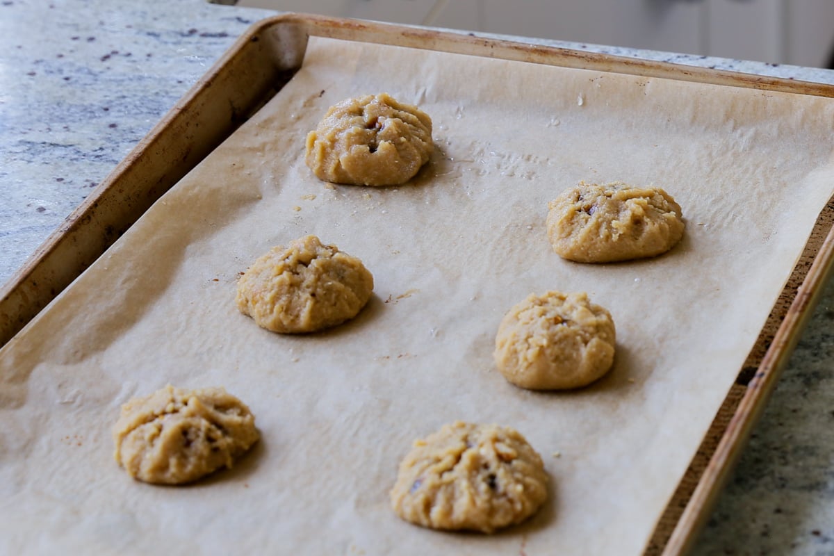 tiramisu cookies, all closed up and ready to bake on a baking sheet