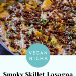 close-up of smoky skillet lasagna in the pan, topped with crispy lentils and fresh herbs, text overlay