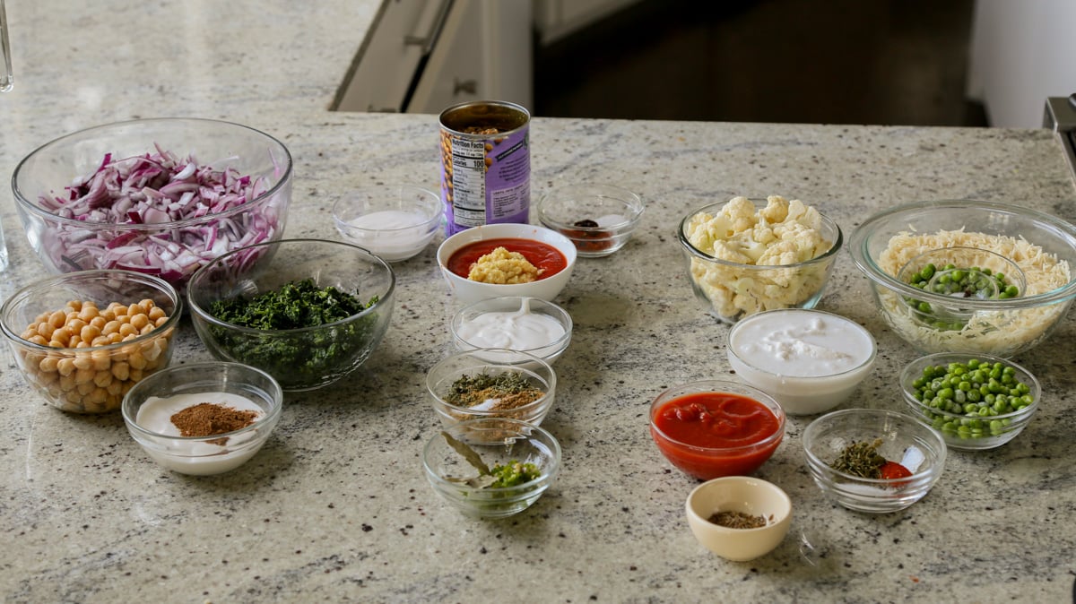 vegan diwali menu ingredients in bowls on a kitchen counter