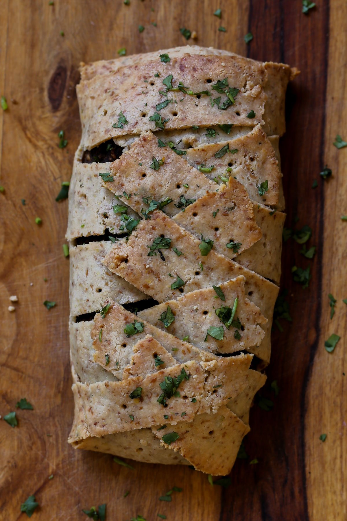 gluten-free vegan beef Wellington on a cutting board after baking