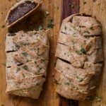 gluten-free vegan beef Wellington on a cutting board after baking and slicing