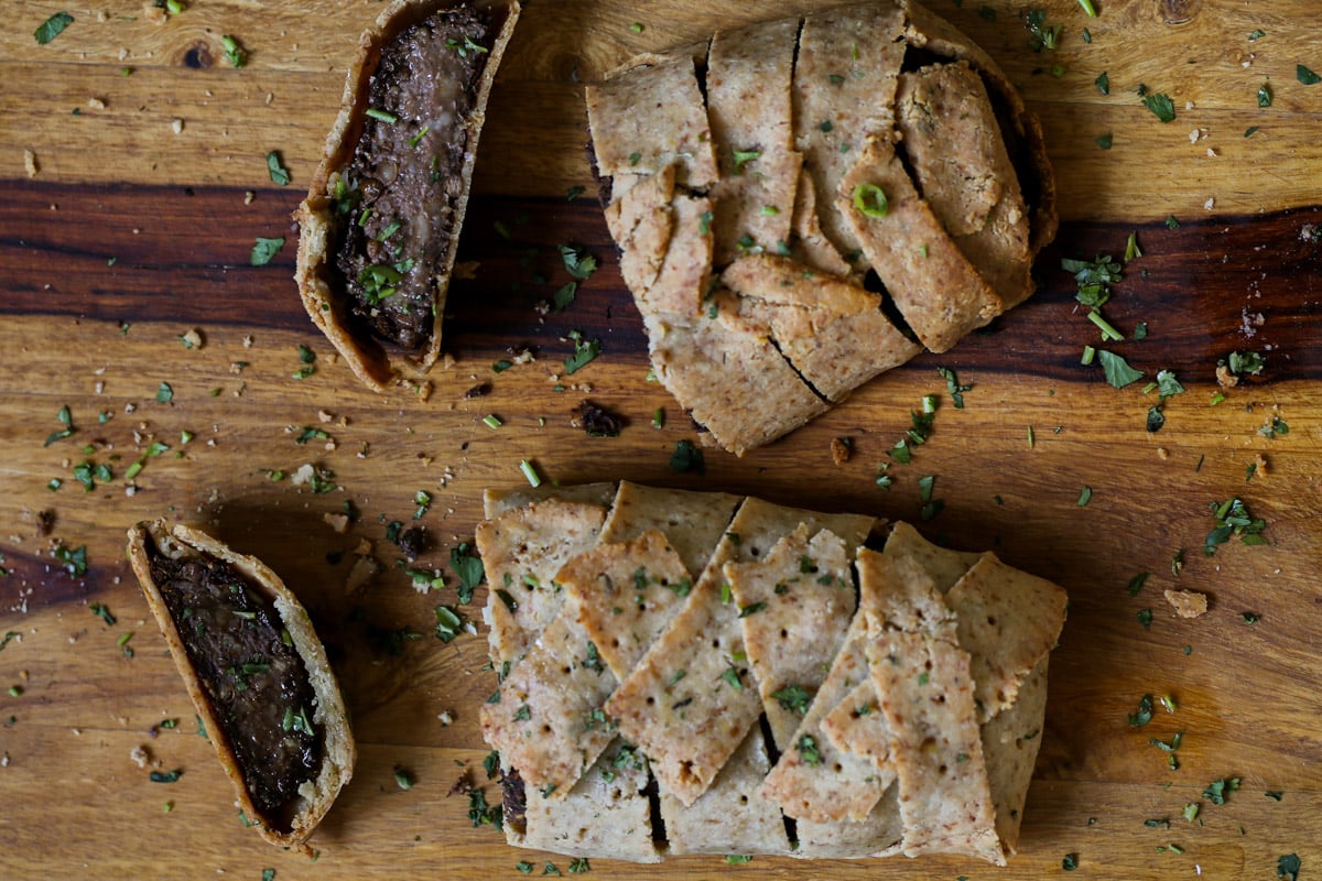 gluten-free vegan beef Wellington on a cutting board after baking and slicing
