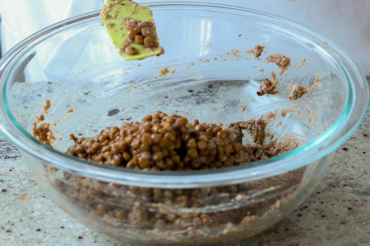 adding whole lentils to the blended lentil mixture