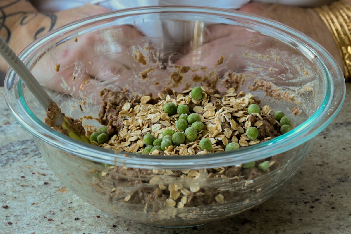adding oats and veggies to the lentil mixture