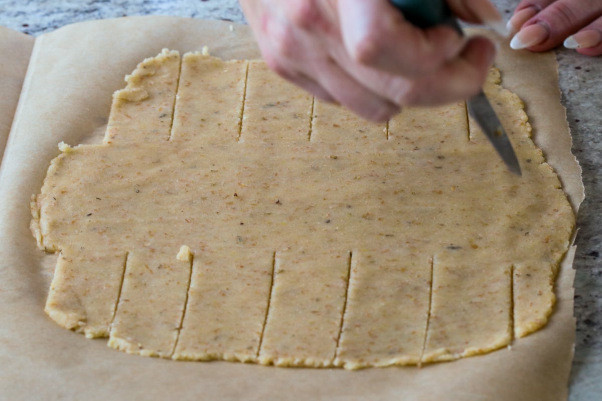 slicing dough for wrapping the Wellington